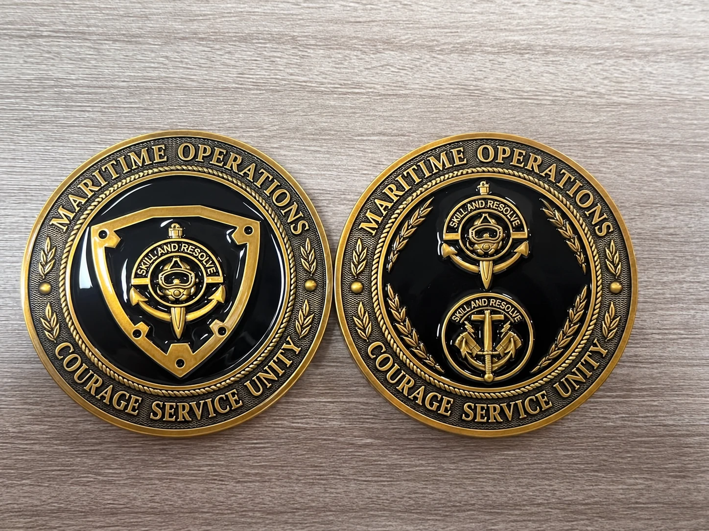 Retouched sample presentation retaining detailed shield and diving motifs, with substituted identifying lettering